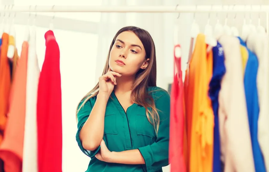 An indecisive apparel store employee trying to choose the best Shopify app.