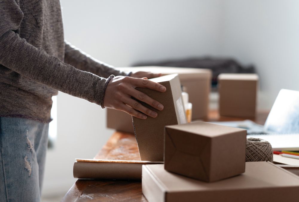 An employee arranging boxes. 