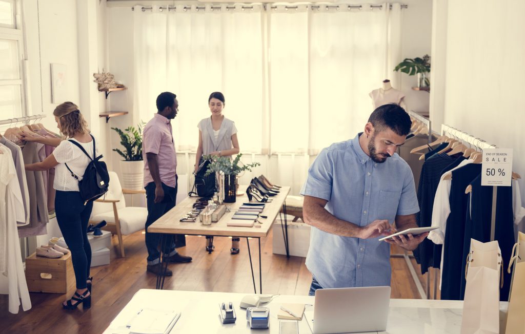 Employees and customers in a clothing store.