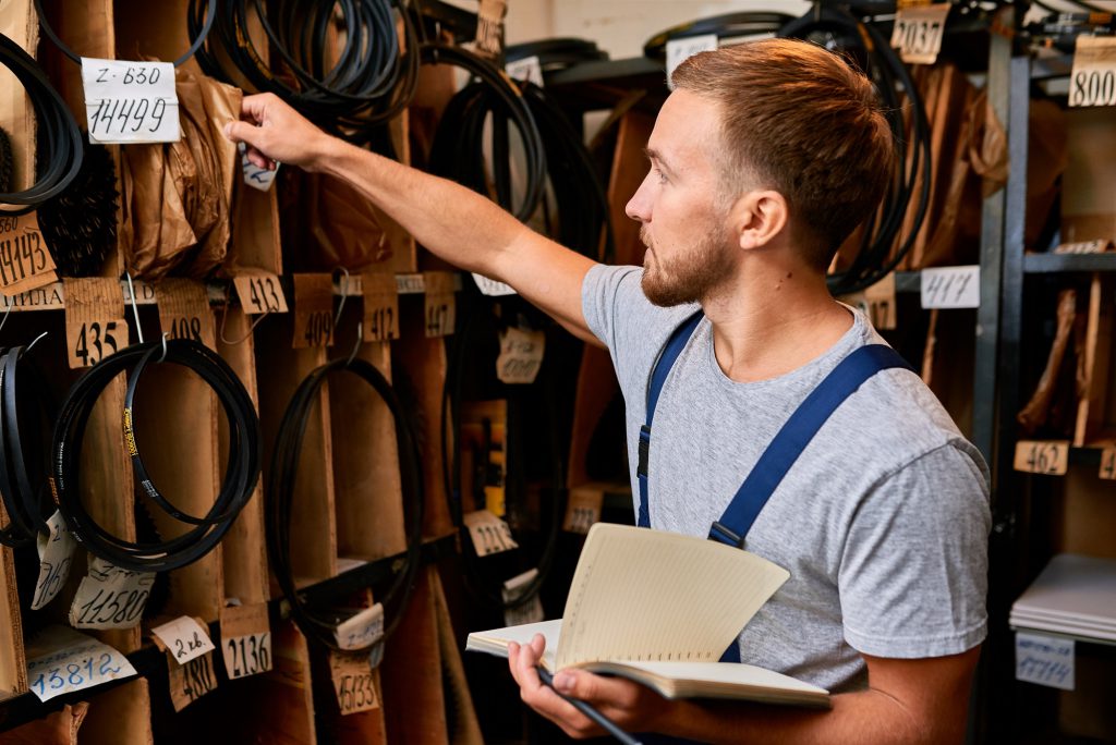 A warehouse employee checking the products. 